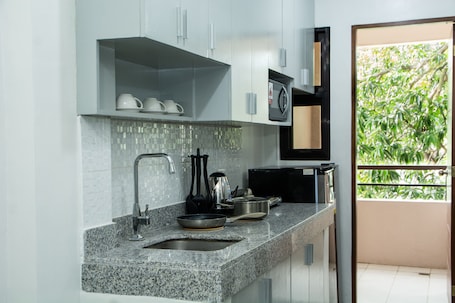 Dining tables. Gibbz Apartelle (Unit 206)