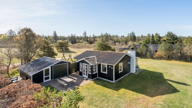 A modern two-story house with a garage, a covered patio, and a large lawn. - "Ingebritt" - 1.5km from the sea by Interhome (Blokhus)