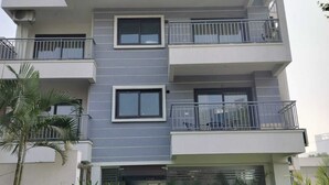 A multi-story building with balconies and a sign reading "ELITE 32 AVENUE". - The Hoften Elite 32 Avenue, Sector 15, Gurugram (Gurugram)
