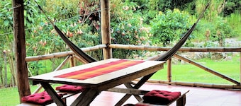 Authentic Vacation Home in Unique Setting of 25 Acres of Tropial River Landscap