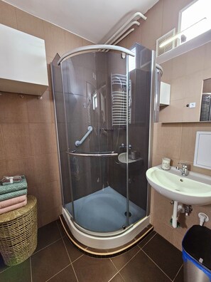 Shower, hair dryer, towels, soap