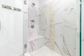 Shower, hair dryer, towels, shampoo