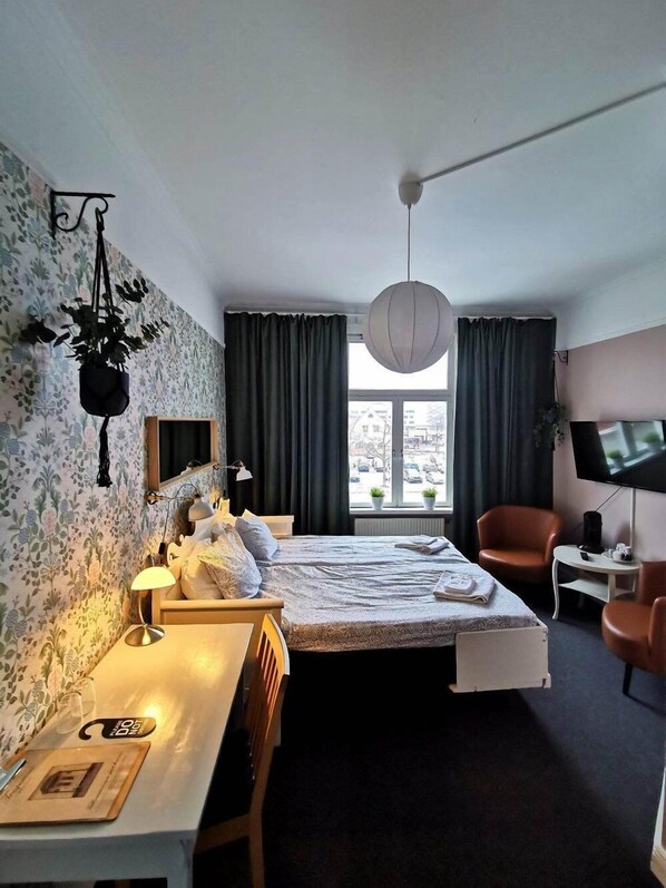 Desk, laptop workspace, blackout curtains, free WiFi