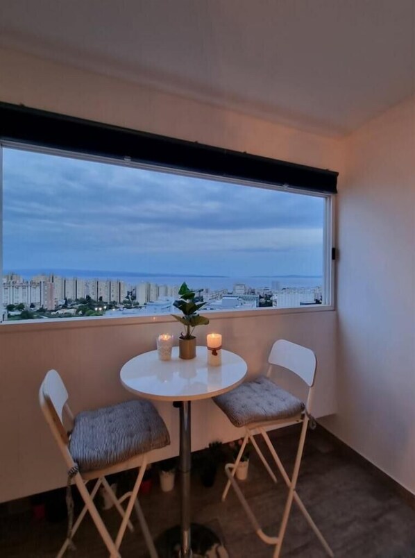 Enjoy a peaceful retreat on your balcony with a city view.