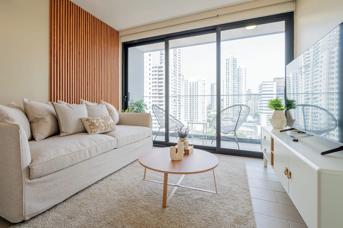 Apartment (17F) | Living area | 55-inch Smart TV with cable channels