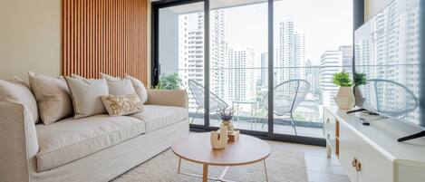 Apartment (17F) | Living area | 55-inch Smart TV with cable channels