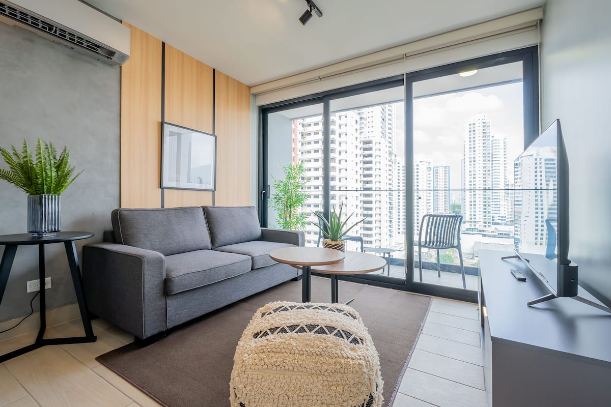 Apartment (18H) | Living area | 55-inch Smart TV with cable channels