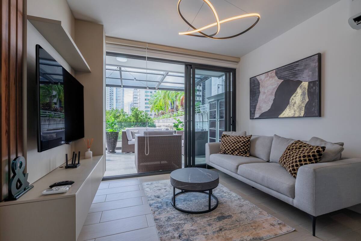 Deluxe Apartment (08C) | Living room | 55-inch Smart TV with digital channels