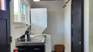 Fridge, microwave, coffee/tea maker, cookware/dishes/utensils