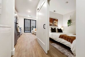 1 bedroom, desk, iron/ironing board, travel crib