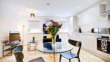 Executive Apartment | Living area | 54-inch Smart TV with cable channels
