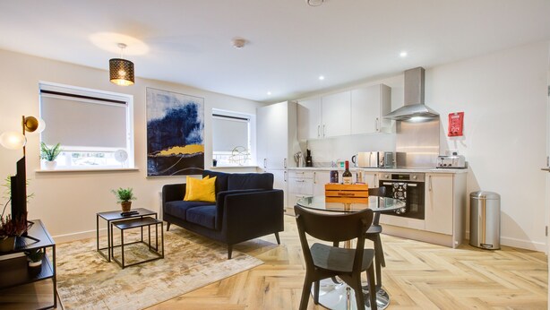 A modern apartment with a living room, dining area, and kitchen. - Hybrid Resi - Mitcham  (Mitcham)