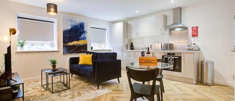 Executive Apartment | Living area | 54-inch Smart TV with cable channels