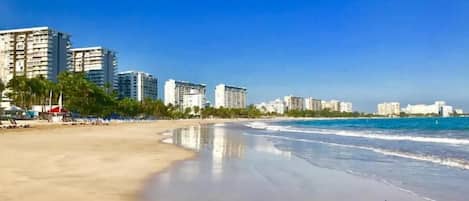 On the beach, sun loungers, beach towels