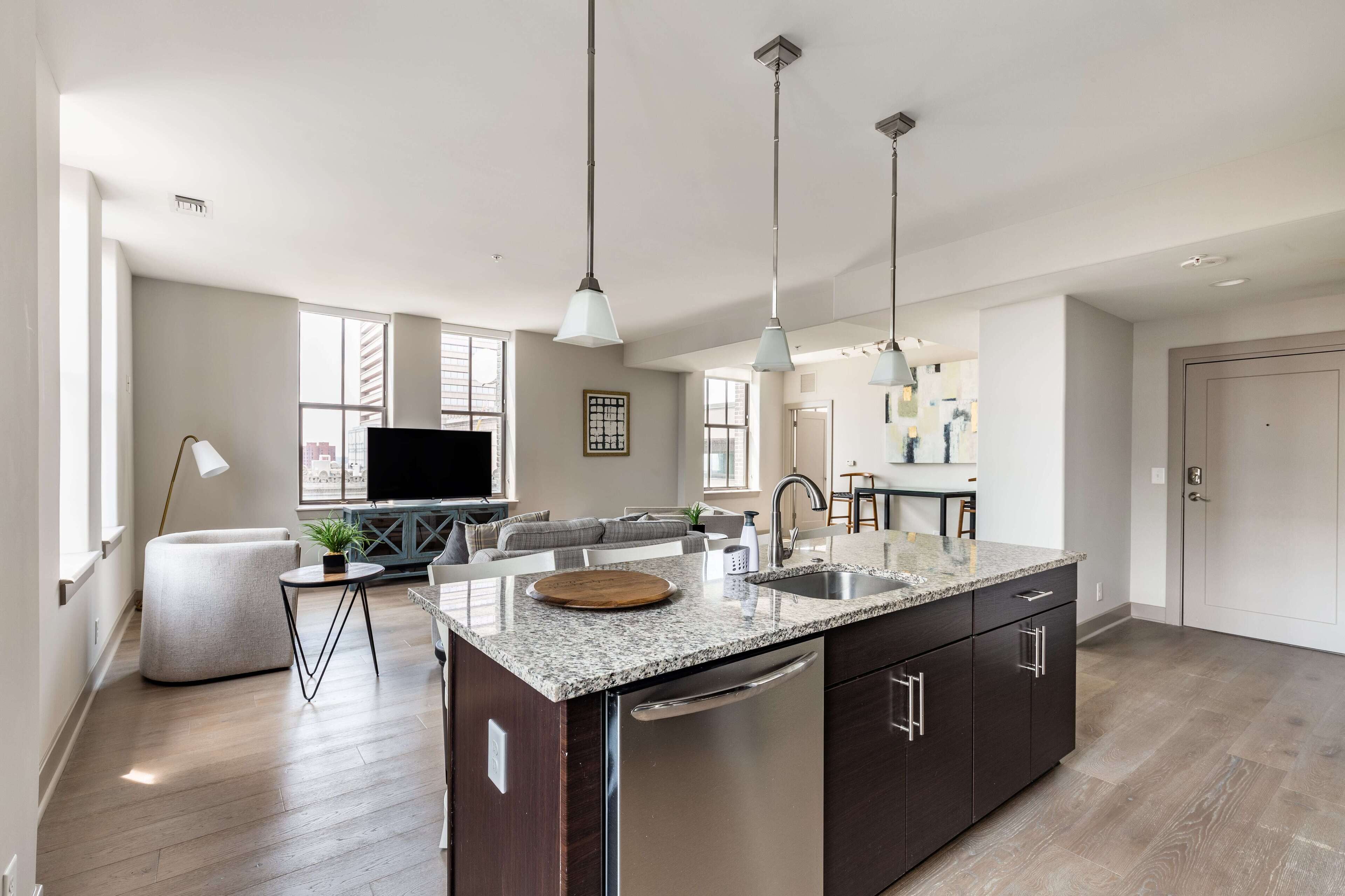 Deluxe Apartment | Living area | 70-inch TV with digital channels