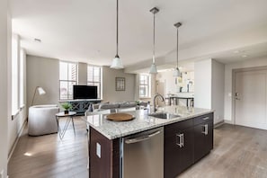 Deluxe Apartment | Living area | 70-inch TV with digital channels - Distinguished Apartment Rooftop Deck (Baltimore)