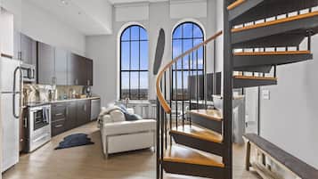 Exclusive Apartment | Living area | 70-inch TV with digital channels