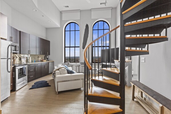 Exclusive Apartment | Living area | 70-inch TV with digital channels - Distinguished Apartment Rooftop Deck (Baltimore)