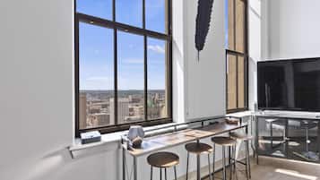 Exclusive Apartment | Living area | 70-inch TV with digital channels