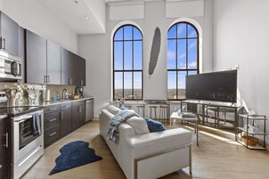 Exclusive Apartment | Living area | 70-inch TV with digital channels