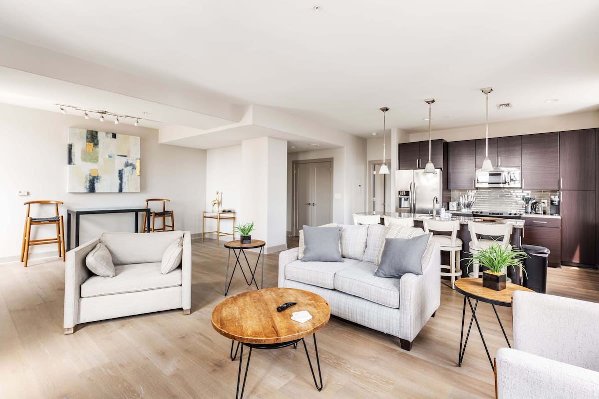 Deluxe Apartment | Living area | 70-inch TV with digital channels