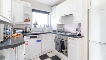 Fridge, oven, toaster, cookware/dishes/utensils