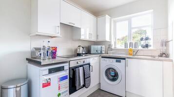 Fridge, oven, toaster, cookware/dishes/utensils