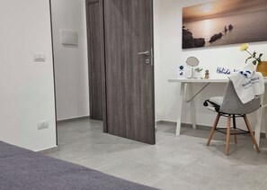 1 bedroom, desk, iron/ironing board, travel cot