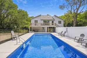 A residential property with a swimming pool, a covered patio, and a two-story house. - House of Friends -- New Listing!  Private Pool, Easy Beach Access (Kitty Hawk)