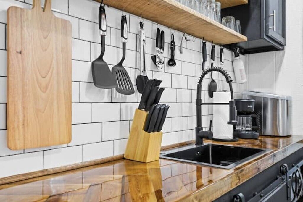 Fridge, microwave, coffee/tea maker, cookware/dishes/utensils