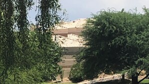 A landscaped area with a grassy lawn, a stone wall, and trees. - Special Summer Rates 1-6 Months Begin April Near Restaurant & Shopping (Fountain Hills)