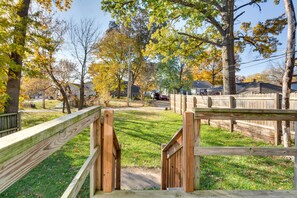 Enter a serene residential area surrounded by mature trees and well-manicured lawns.