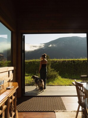A room with a wooden interior, a wooden table, and a bench. - Signature Home By Aspects w/ Hot Tub, Sauna + Views (Big Sky)