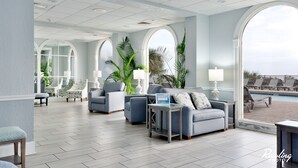 A spacious lobby with a pool view, modern furniture, and large windows. - ⛱ DIRECT OCEANFRONT⛱ PENTHOUSE VIEW! ALL NEW LARGE BALCONY! ALL NEW RENOVATION! (Myrtle Beach)