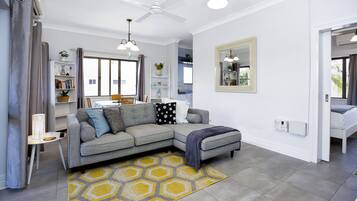 Classic Apartment | Living area | 55-inch Smart TV with digital channels