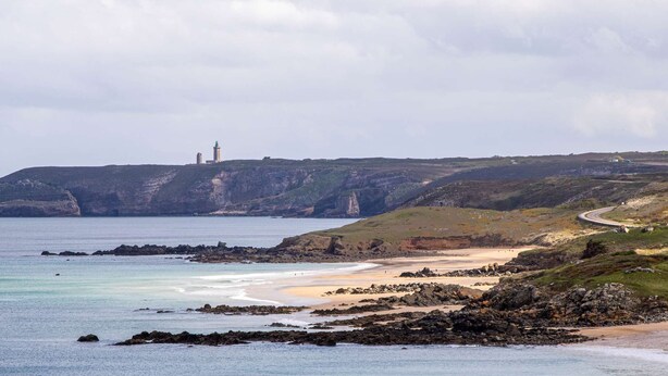 A coastal landscape with a lighthouse, rocky shoreline, and a winding road. - Apartment near beaches in Fréhel | 4 guests | Ref 359 (FREHEL)