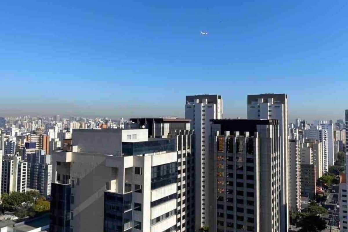 A cityscape with high-rise buildings and a clear sky.