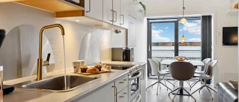 Fridge, stovetop, dishwasher, coffee/tea maker