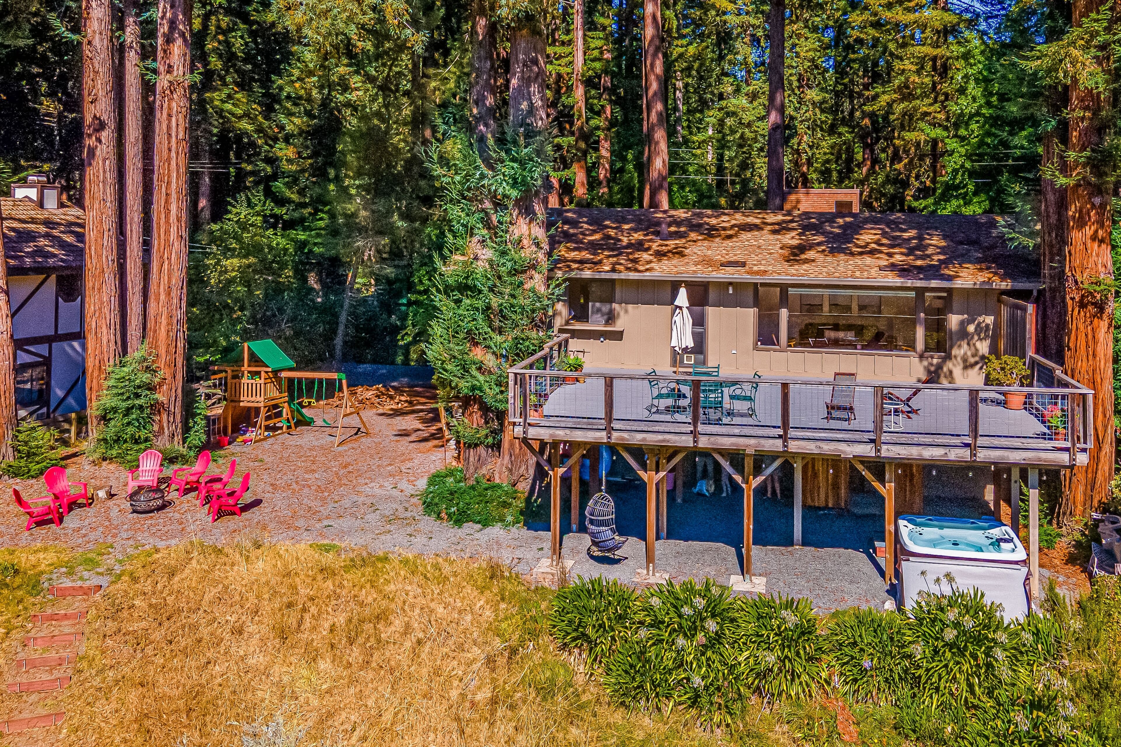 Secluded riverfront home with large deck, hot tub, & wood fireplace- dogs OK