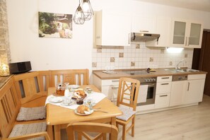 Enjoy meals in the kitchen with a dining table and adjacent seating area.