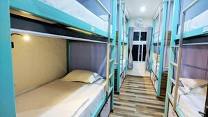 A corridor with bunk beds, wooden flooring, and a door at the end. - Hostel Nepal Pvt. Ltd. (Pokhara)