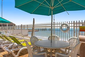 Outdoor dining - Waterfront duplex with hot tub, pool, & beach access - W/D, balcony, and grill (Key Colony Beach)