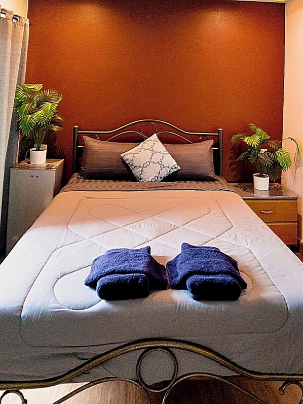 Kamar Mewah | Seprai antialergi, minibar gratis, tirai kedap cahaya, dan Wi-Fi gratis