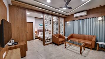 Family Studio | Living area | Flat-screen TV