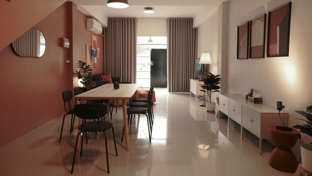 A modern dining area with a long table, black chairs, and a white cabinet. - 4 Bedrooms, Private&Cozy @ Walking Street (Chang Wat Chiang Rai)