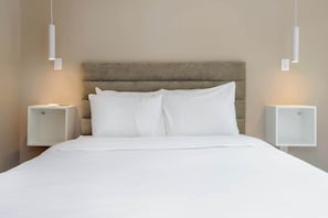 A neatly made bed with white linens in a hotel room. - w* | Vibrant 2BR with Balcony in Condesa (Ciudad de México)