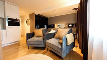 Business Apartment, Kitchen | Living area | 55-inch Smart TV with cable channels, pay films, heated floors