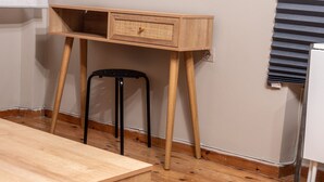 A wooden desk with drawers, a black chair, and a whiteboard on a wall. - CAMPIELLO Apt. by LOC HOSPITALITY (Corfu)