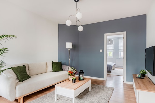 Apartamento conforto | Área de estar | TV de tela plana