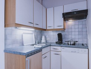 Fridge, stovetop, dishwasher, coffee/tea maker